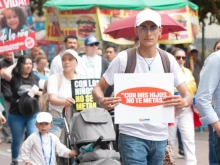 “Don’t mess with my children,” reads a sign carried by a participant in one of some 30 marches on Oct. 19, 2024, in Colombia to protest the country’s health department memorandom that sanctions sex changes for minors.