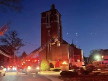 Firefighters work to extinguish the fire at St. Mary Church in Franklin, Massachusetts, Wednesday, Oct. 23, 2024.