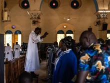 Worshippers attend a Mass at Ouagadougou's Catholic cathedral on June 12, 2022, in Burkina Faso. The country has been grappling with Islamist terrorism since 2015 and Christian communities live in fear of furhter attacks.