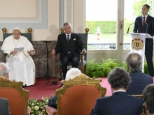 Pope Francis and King Philippe listen to a speech by Belgium Prime Minister Alexander De Croo during the pope’s trip to Belgium in late September 2024.