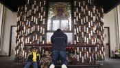 A man prays at the Candlelight Chapel at the National Shrine to Czestochowa in Doylestown, Pennsylvania, on April 2, 2005, the day Pope John Paul II died.