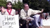 Long-time pro-life activist Eva Edl (left) prays in front of a Senate office building on Capitol Hill, Sept. 6, 2001 to protest US President George W. Bush's decision to allow limited stem cell research.