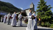 Priests and deacons of the Society of St. Pius X walk to Mass in Econe, western Switzerland, on June 29, 2009.